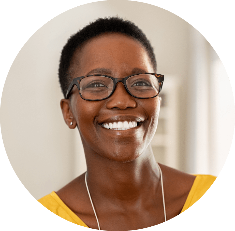 Woman smiling with yellow shirt.